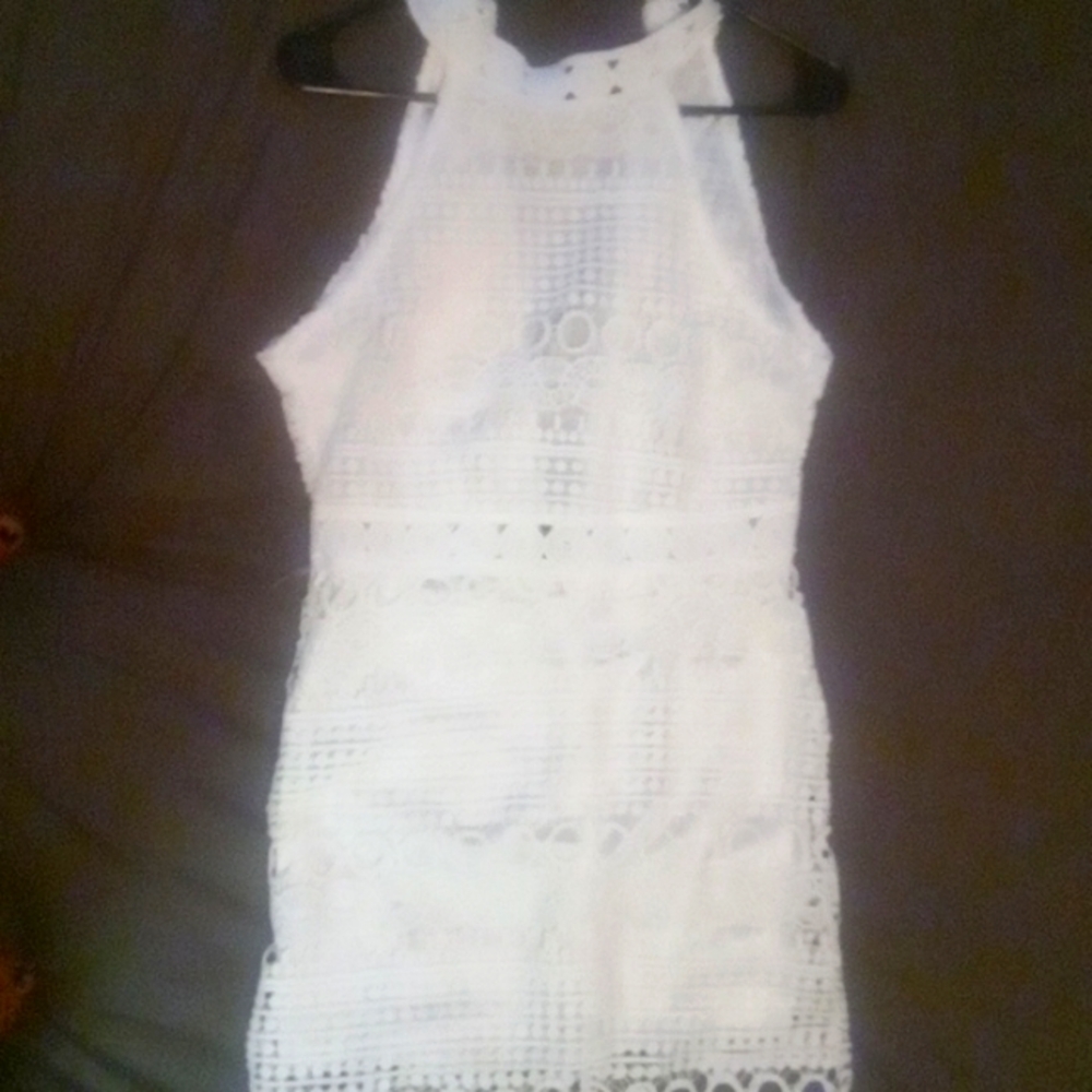 A white knee length Dress.